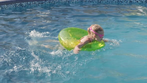 Little Boy and Girl Swimming in Swimming Pool Children Having Fun Splashing Water