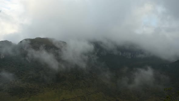 Time lapse of low clouds moving over mountains