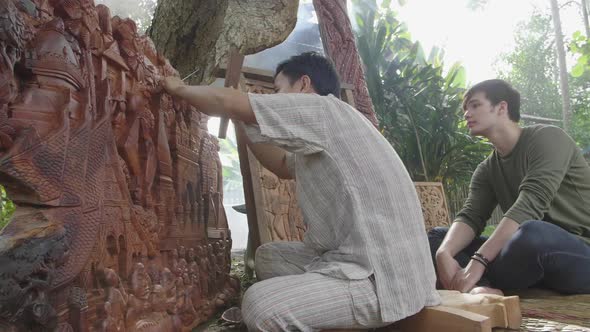 Young Man Looking Carpenter Carving Wooden