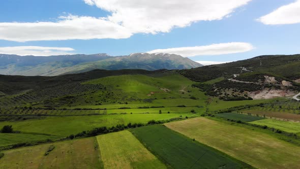 Aerial Panoramic View of Scenic Landscape in the Alps with Rugged Alpine Mountain Peaks and Lush