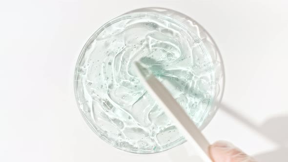 Transparent Cosmetic Gel Fluid in a Glass Bowl of Petri