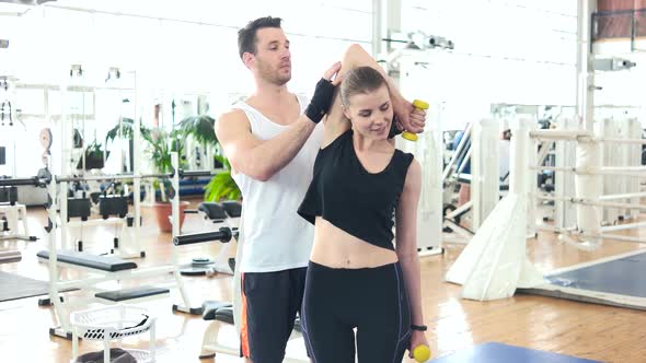 Slim Girl Exercising at Fitness Center