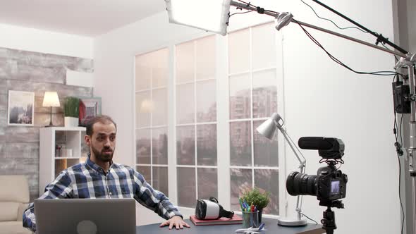 Behind the Scenes of Young Caucasian Man Recording a Vlog