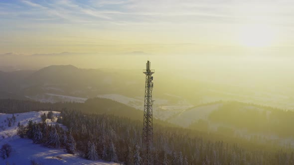 Flying Over Radio Communications Tower Mountain Snow Covered Winter Landscape