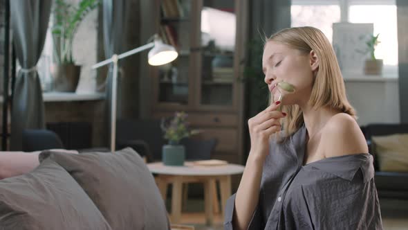 Woman Enjoying Facial Massage At Home