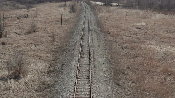 Tranquil scene of swaying grass and railroad track 4K drone video