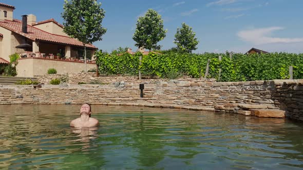 Woman Relaxing the Countryside in Natural Swimming Pool From Stone  Tuscany Italy