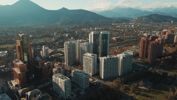 High Rise Buildings In Las Condes District Near Araucano Park In Santiago, Chile - aerial drone shot