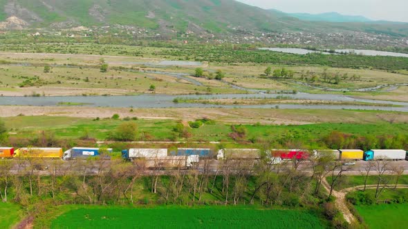 Zoom Out View Lorry Trucks On Side Of Road Standing In Mountains