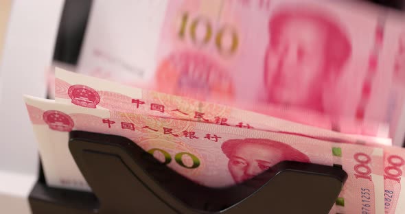 Chinese paper banknote on counting machine