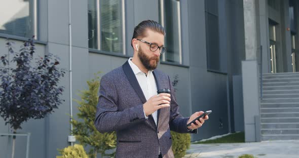 Office Manager which Listening Music in Airpods from Phone Playlist and Enjoying Coffee