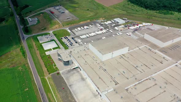 Aerial view of industrial poultry house in the country. Modern Factory Exterior.