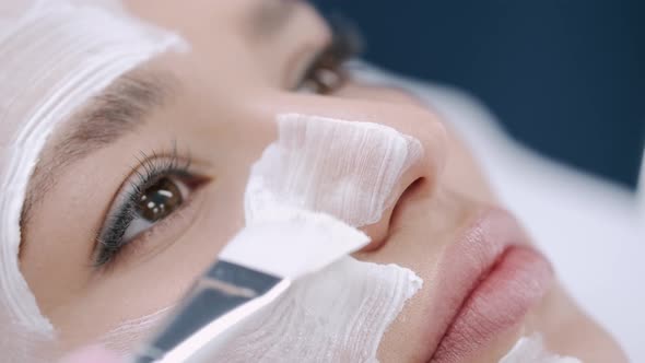 Cropped View of Beautician Putting Facial Mask on Face