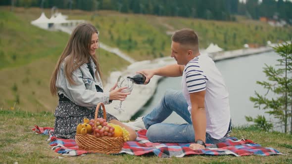 Couple on a Picnic Drink Wine