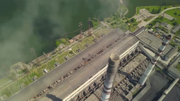 Chimneys of a Thermal Power Plant. Shooting From the Height of an Energy Object Running on Fossil