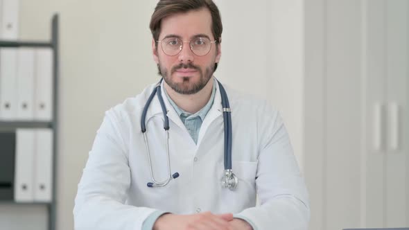 Portrait of Young Male Doctor Looking at Camera