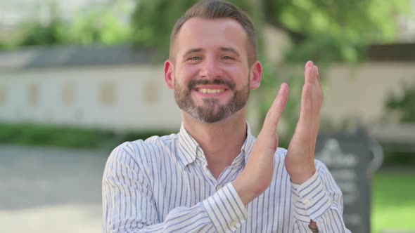 Outdoor Portrait of Sleeping Middle Aged Man Clapping Applauding