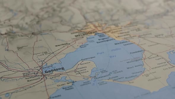 Slider Shot With Shallow Depth of Field to Reveal the Australian City of Melbourne on a Printed Map