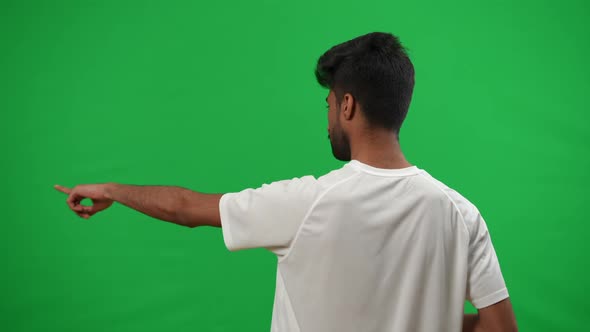 Back View Middle Eastern Football Coach Gesturing Pointing on Green Screen Template