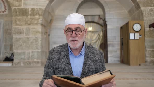 Praying From Quran On Holder