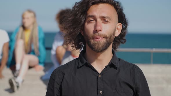 Young Stylish Man in Sunlight on Seafront