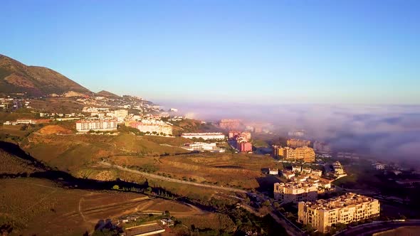 Panoramic view of Fuengirola, Malaga, Spain covered in fog.