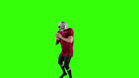 American football player on green screen background.