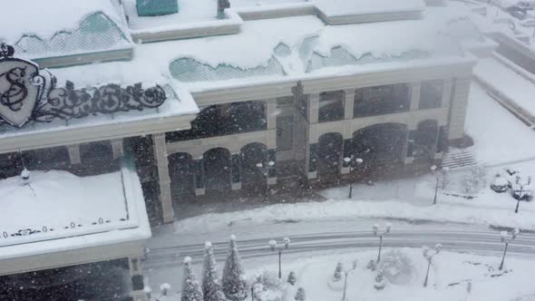 Aerial Shooting While Winter Snowfall in Modern City