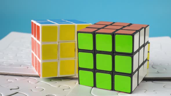 Rubik cube and jigsaw puzzle.