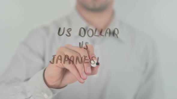 Dollar Vs Japanese Yen Writing on Screen with Hand
