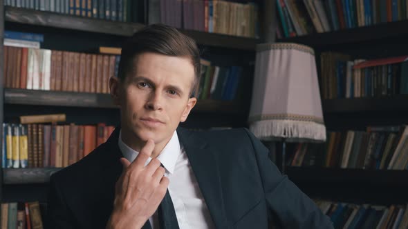 Portrait of Handsome Confident Young Businessman in the Office. Wearing Classic Suit. Male Employee