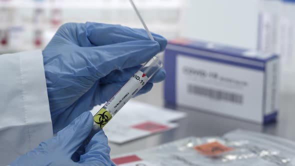 Coronavirus swab test being sealed in vile and plastic bag