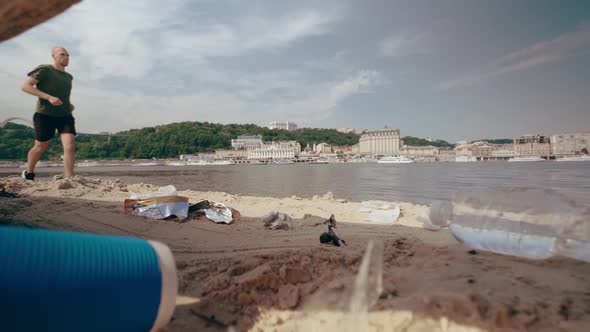 Man Collects Plastic Waste on the Beach