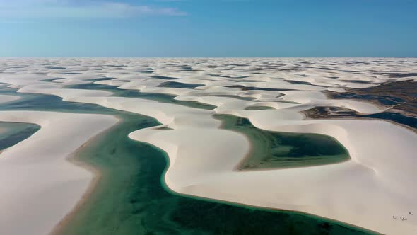 Sand dunes mountains and rain water lagoons at northeast brazilian paradise.