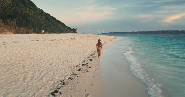 Woman Run on Morning Tropical Beach