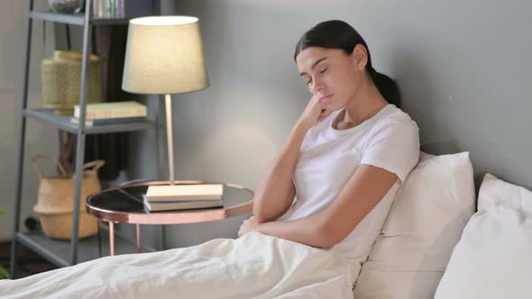 Sleepy Young Latin Woman Taking Nap in Bed 