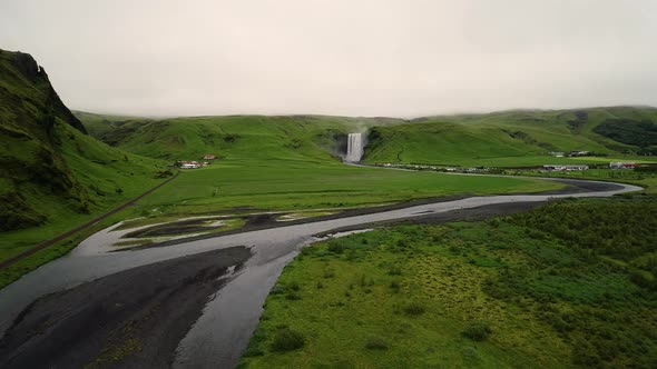 Faraway aerial view of Skogafoss waterfall on the southern region of Iceland.