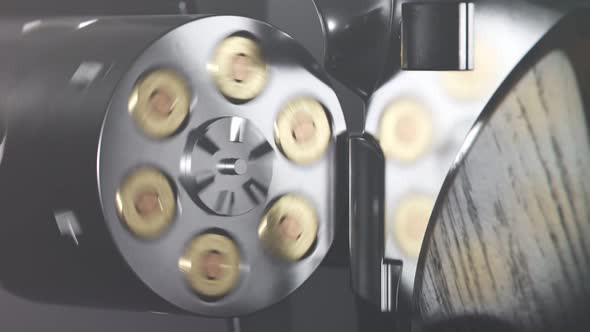 Revolver spinning cylinder holding six cartridges. Close up. Ready to shoot.