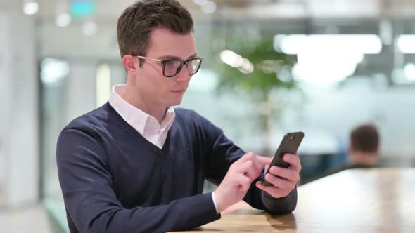 Young Businessman Using Smartphone