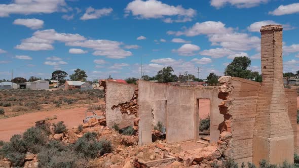 Flying towars Silverton in outback New South Wales passing over abandoned buildings