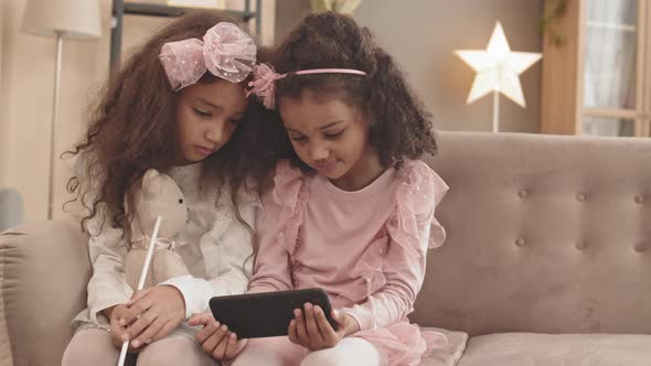 Little Sisters Watching Smartphone