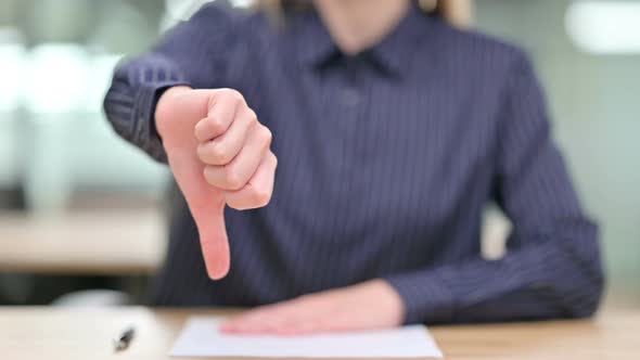 Close Up of Businesswoman Showing Thumbs Down 