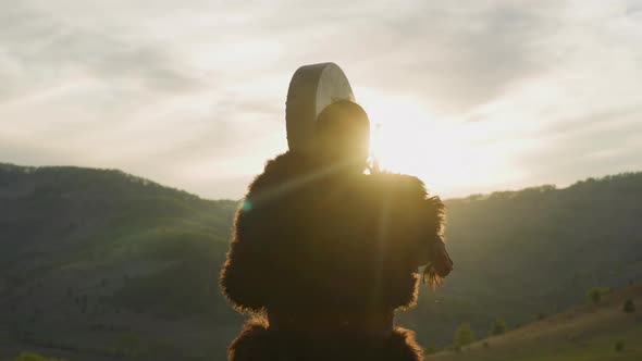 Man Conducts Battle Victory Ceremony Against Mountains