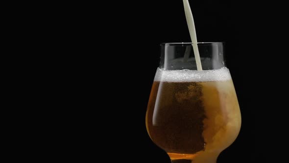 Beer Is Pouring Into Glass