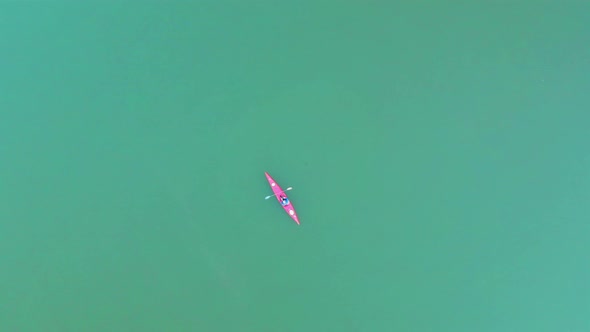 Top View of Man on Kayak in Turquoise Water