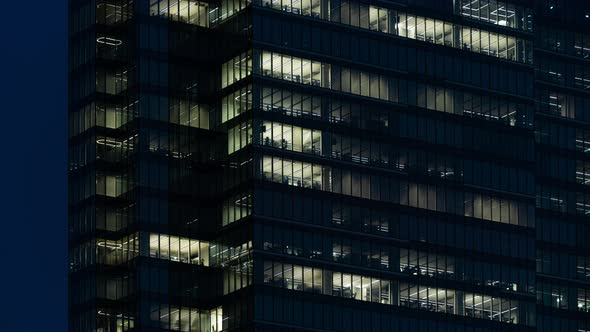 Time Lapse People Working Late Night Office Windows Light in Business Center Building Facade