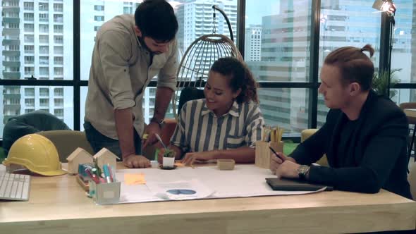 Creative Business People Group Having Conversation at Office Desk in Workplace