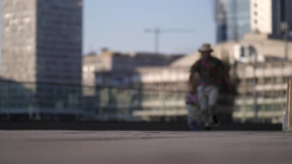 Active Male Skater Running and Jumping on Board