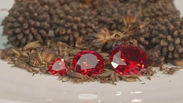 Red Ruby Diamonds In A Pile Of Kratom Seeds.