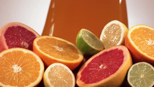 Slow Motion Shot of Citrus Fruits and Juice Splashing Through Lemon Lime Grapefruit Slices